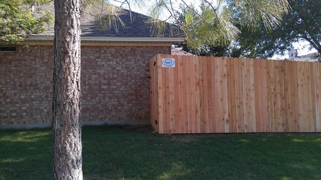Side by side dog eared cedar fence