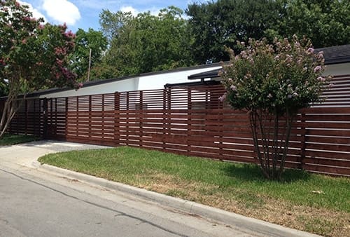Custom horizontal cedar fence pecan stained with sliding gate