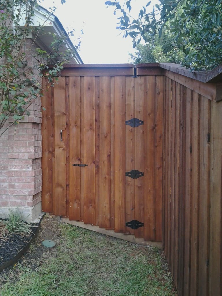 Board on board fence with concrete slope