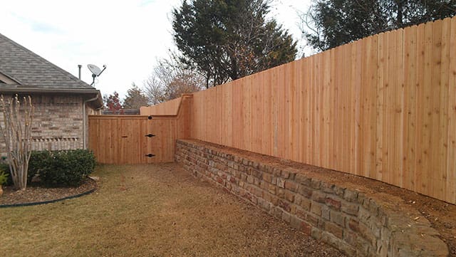 Side by side natural cedar fence