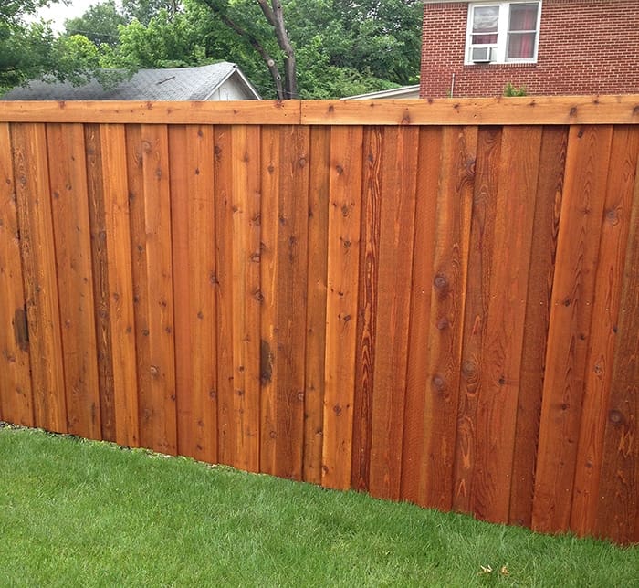 Board on board cedar fence with cap