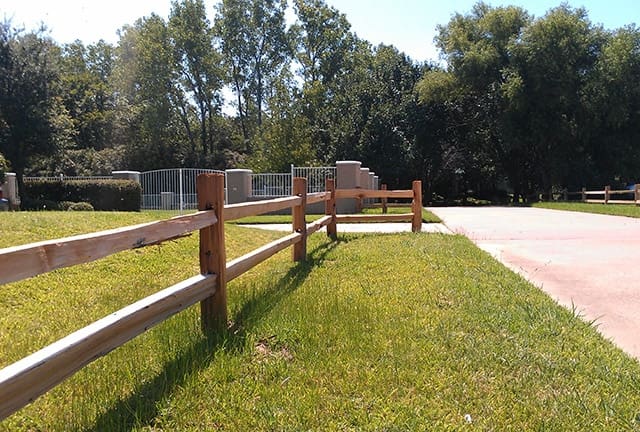 Two rail ranch style cedar fence
