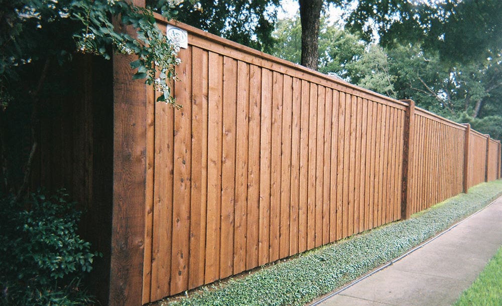 Stained Wooden Fence in Grass Area