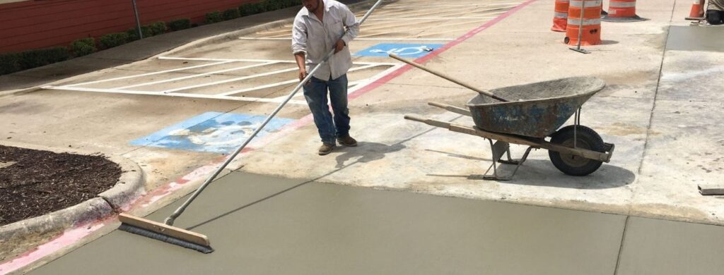 A worker finishing commercial concrete.