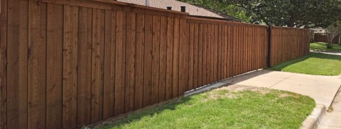 A beautiful wooden fence on a residential home.