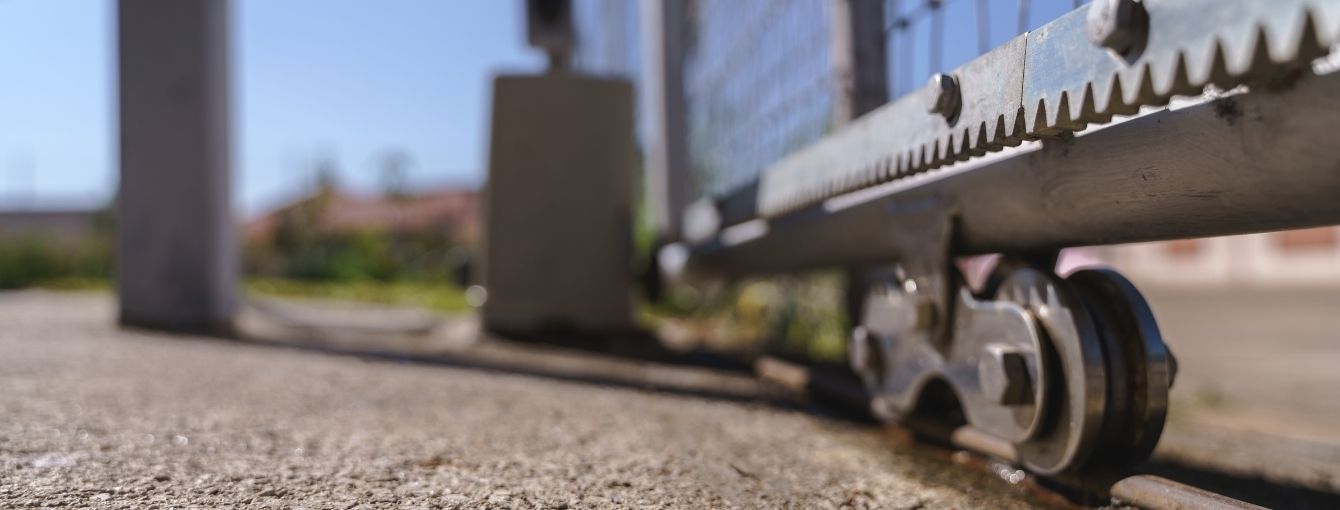 A close-up of the mechanics for a slide gate.