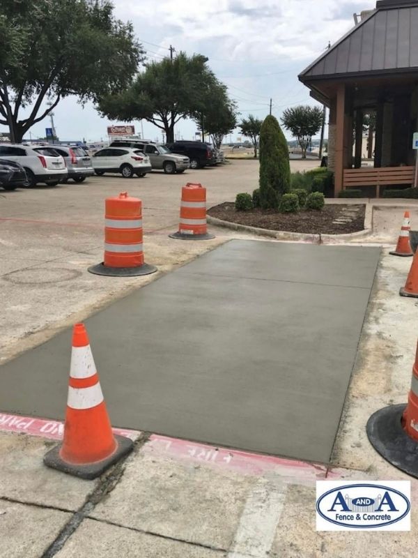 Fresh concrete poured in front of a business. 