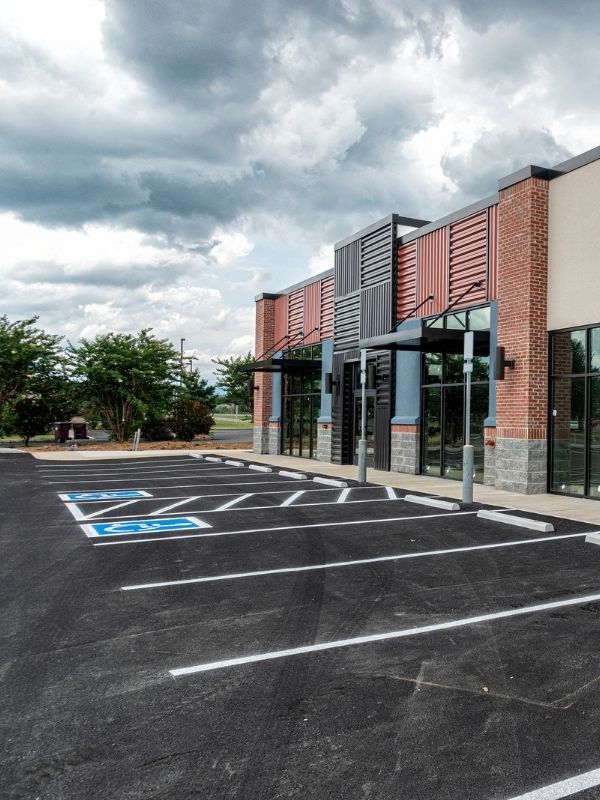 A new parking lot with handicap spots at a strip mall. 
