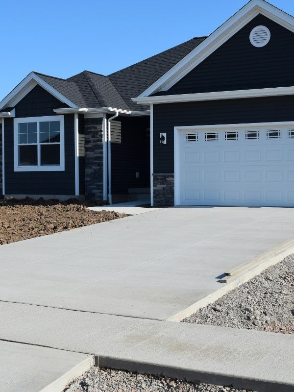A new residential concrete driveway was installed into a home. 