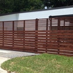 Custom horizontal cedar fence with sliding gate