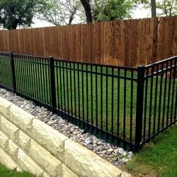Iron fence and cedar fence