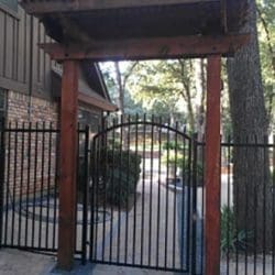 Cedar arbor over iron gate